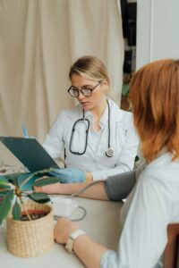 Pregnant Woman Takes Blood Pressure Test