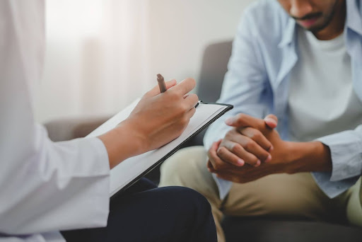 Doctor prescribing a man with prostate cancer 